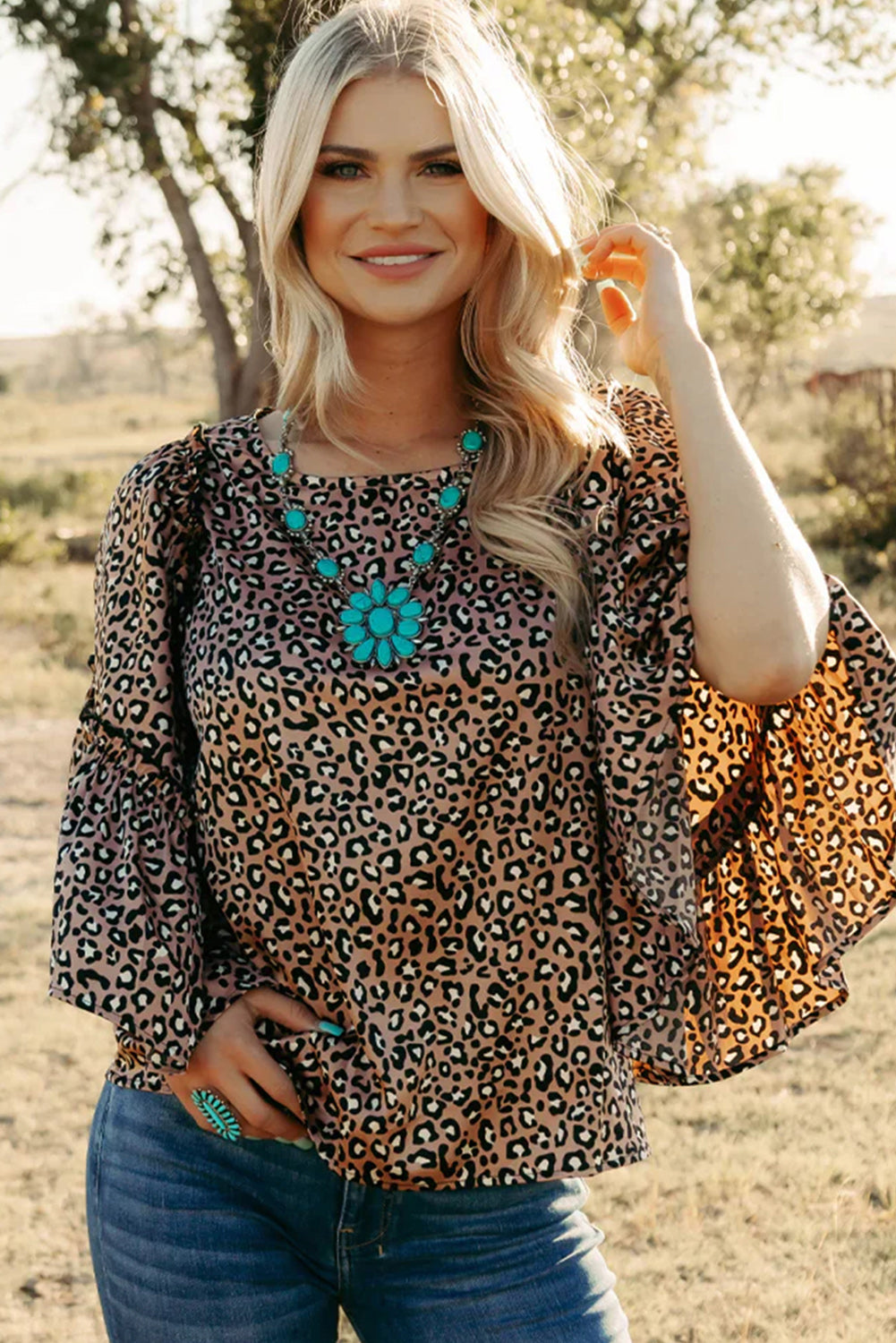 Chestnut Leopard Ruffle Flounce Sleeve BlouseMaterial:97%Polyester+3%Elastane



		The blouse is a stylish and feminine top featuring a trendy leopard print and flounce sleeves, adding a touch of flair to you