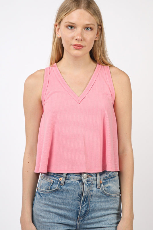 VERY J V-Neck Knit Swing Cropped TankLook effortlessly chic in this Sleeveless Soft Knit Swing Crop Top featuring raw edge detail, designed to add a touch of casual charm to your outfit. This soft girlc