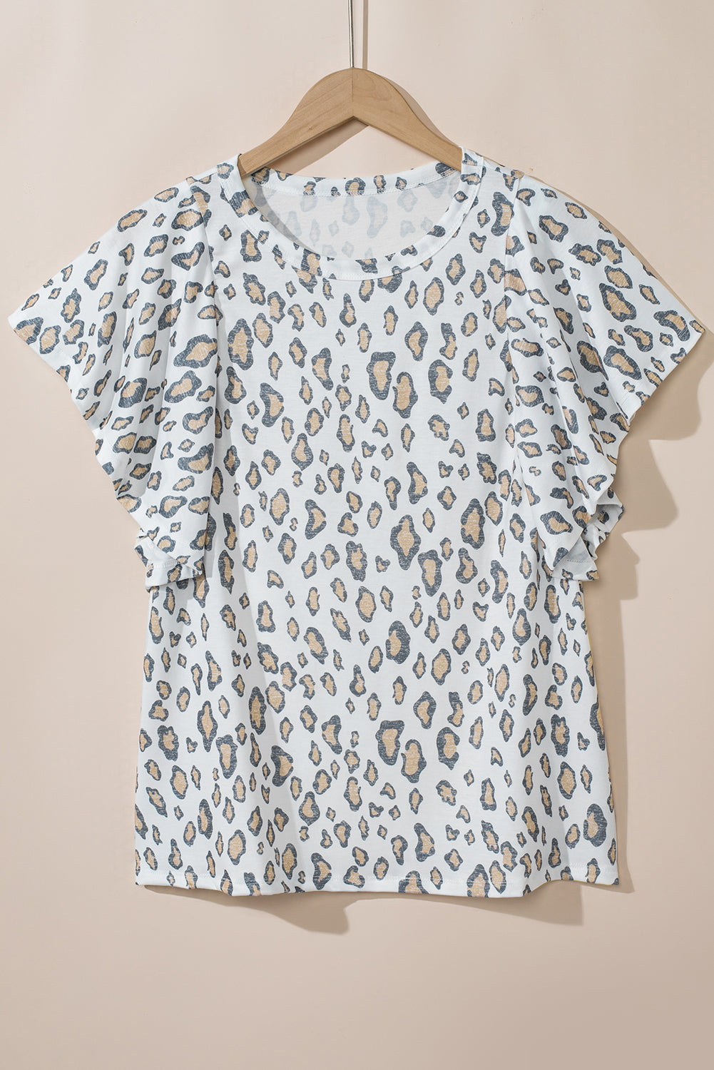 White Leopard Print Ruffle Short Sleeve BlouseMaterial:95%Polyester+5%Elastane



		With its ruffle short sleeves, this blouse exudes a feminine and playful vibe, perfect for adding a touch of flair to your lo