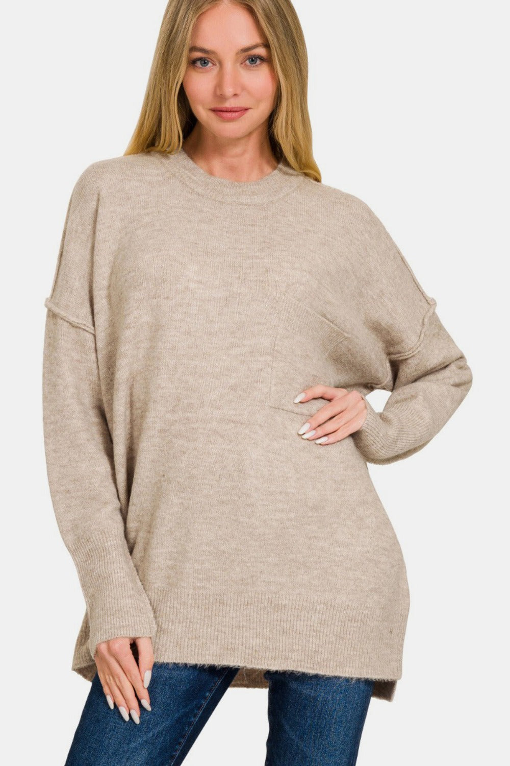 Zenana High-Low Hem Drop Shoulder SweaterThis hi-low hem pocket sweater is crafted from soft and midweight material, making it both cozy and comfortable for everyday wear. The hi-low hem adds a trendy touch