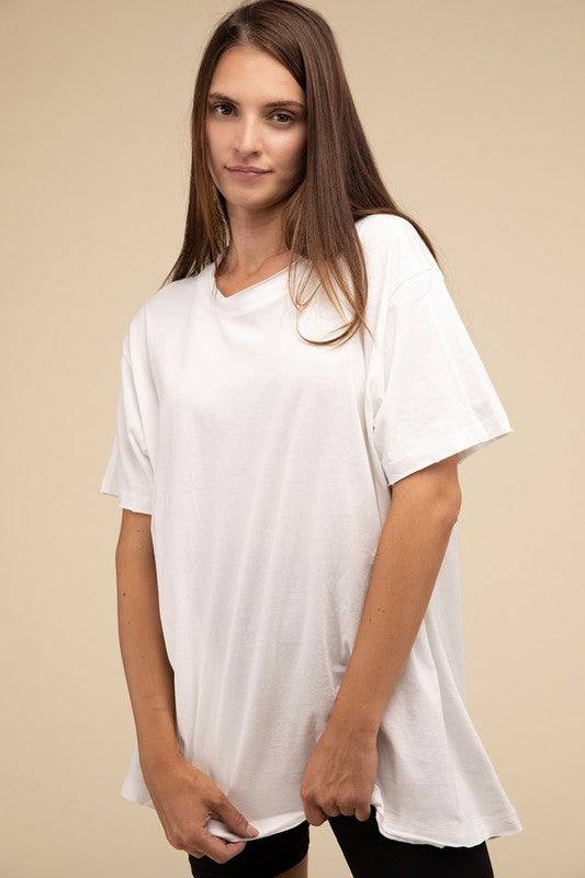 Cotton Drop Shoulder Oversized TopThe Cotton Drop Shoulder Oversized Top is a chic and comfortable addition to your wardrobe. With raw edge details adding a touch of edge, this top offers a relaxed, 