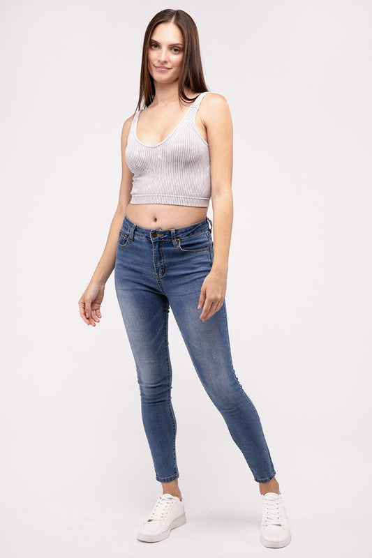 Washed Ribbed Cropped V-Neck Tank TopThe Washed Ribbed Cropped V-Neck Tank Top offers a stylish and comfortable option for your wardrobe. Made from ribbed fabric with a washed finish, it exudes a casual