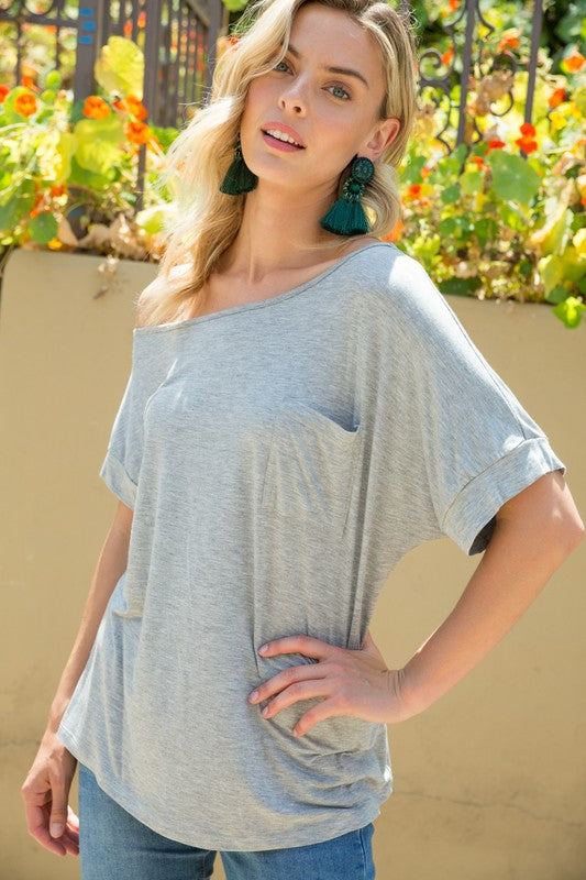 SOLID ONE SHOULDER TOPSOLID JERSEY ONE SHOULDER TOP- Solid one shoulder top- Chest pocket- Loose fit- Solid jersey- Model is 5' 8" 31-24-35 and wearing a Small- 95% RAYON, 5% SPANDEX- MAD