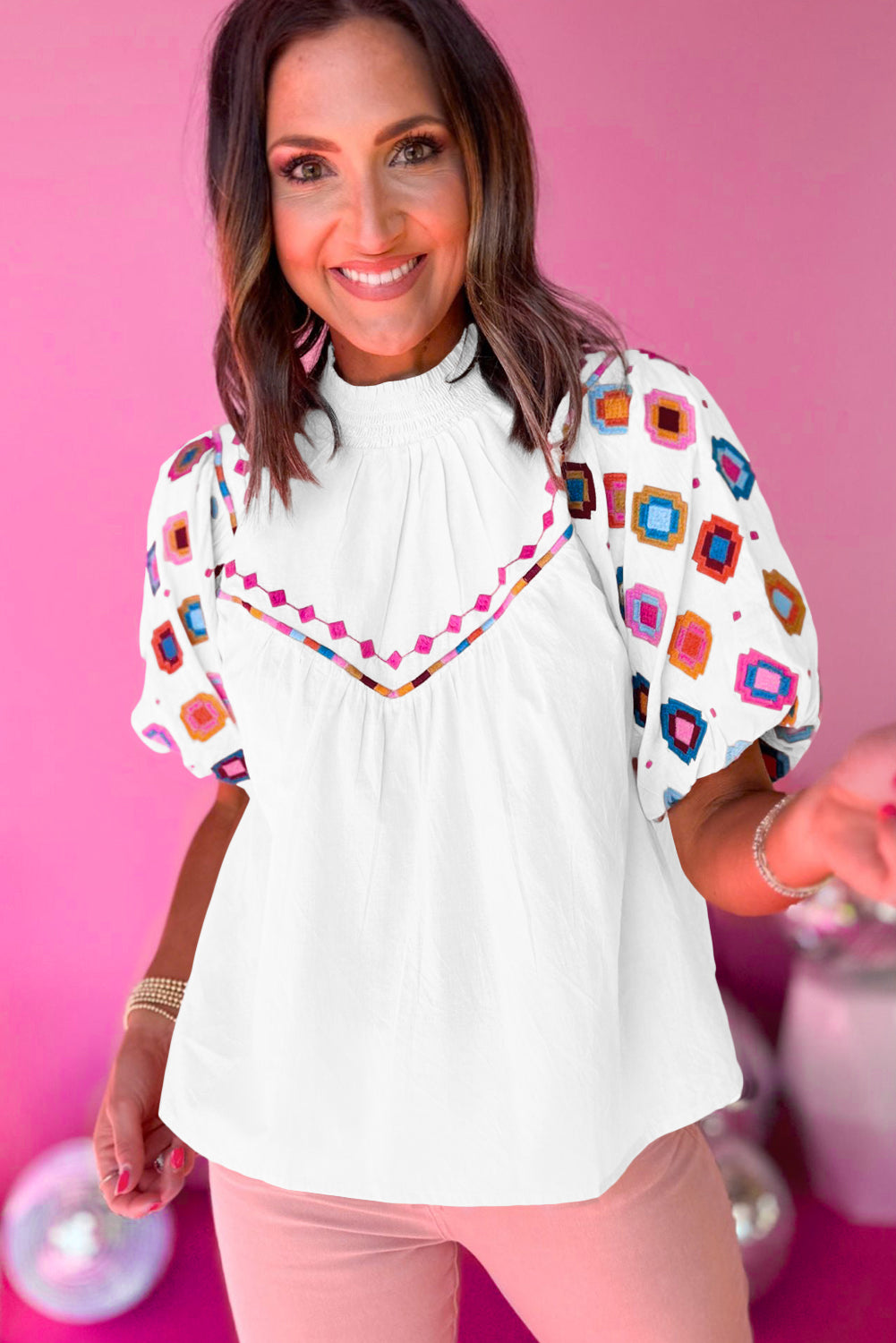 White Geometric Embroidered Smocked Neck Puff Sleeve TopMaterial:100%Cotton


	


		Elevate your style with our top, a charming piece that combines trendy details with a touch of elegance.
	
	
		This top features i