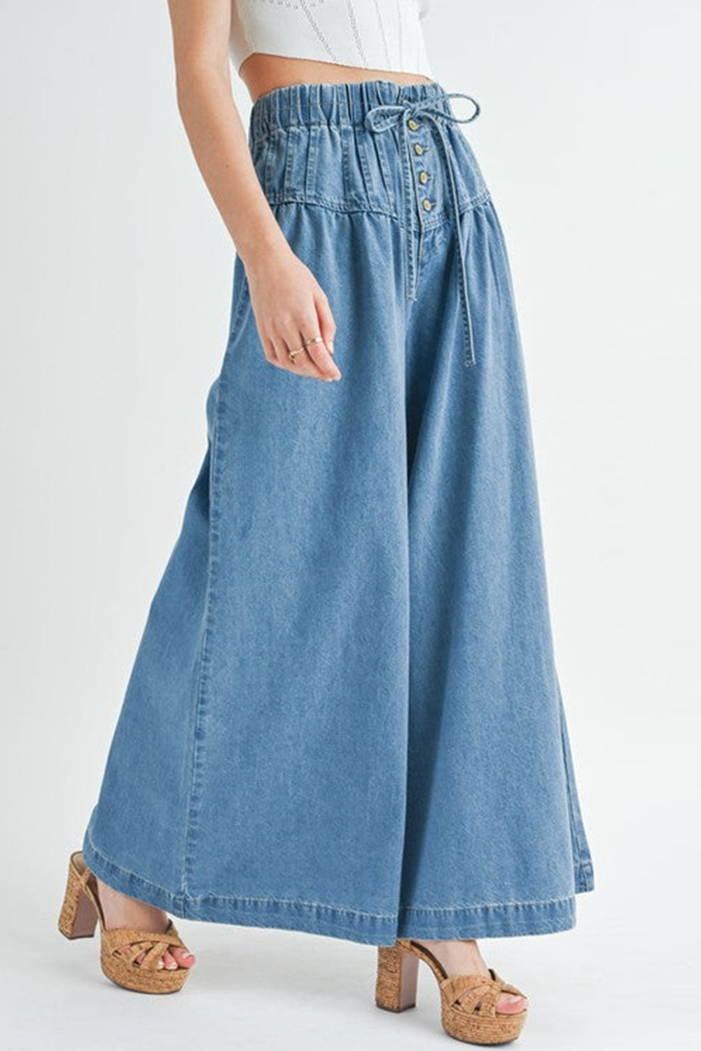 Dusk Blue Mineral Wash Button High Waist Wide Leg JeansMaterial:100%Cotton

• Crafted in a trendy mineral wash, these high waist wide leg jeans exude casual elegance, perfect for a laid-back yet stylish look.
• Featuri