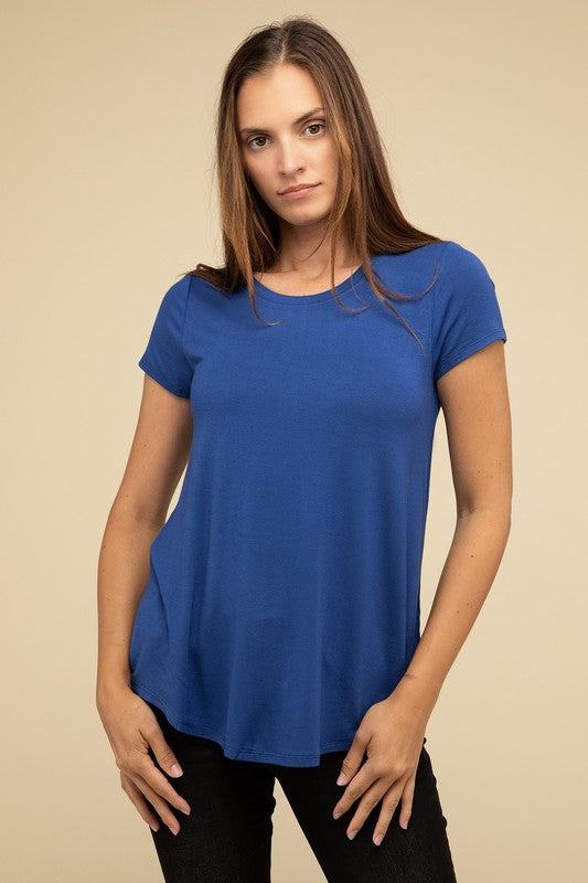 Flowy Round Hem Rayon Short Sleeve TopThe Flowy Round Hem Rayon Short Sleeve Top is the perfect addition to your casual wardrobe. Crafted from soft, lightweight rayon, this top features a relaxed fit and