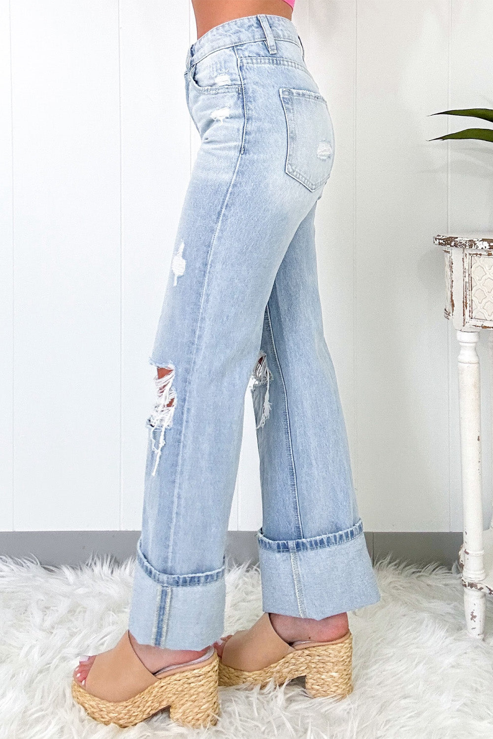 Beau Blue Light Wash Distressed Flare JeansMaterial:93%Cotton+5%polyester+2%Elastane

• The jeans are designed for comfort and style, perfect for everyday wear.
• The high waist design of these jeans provid