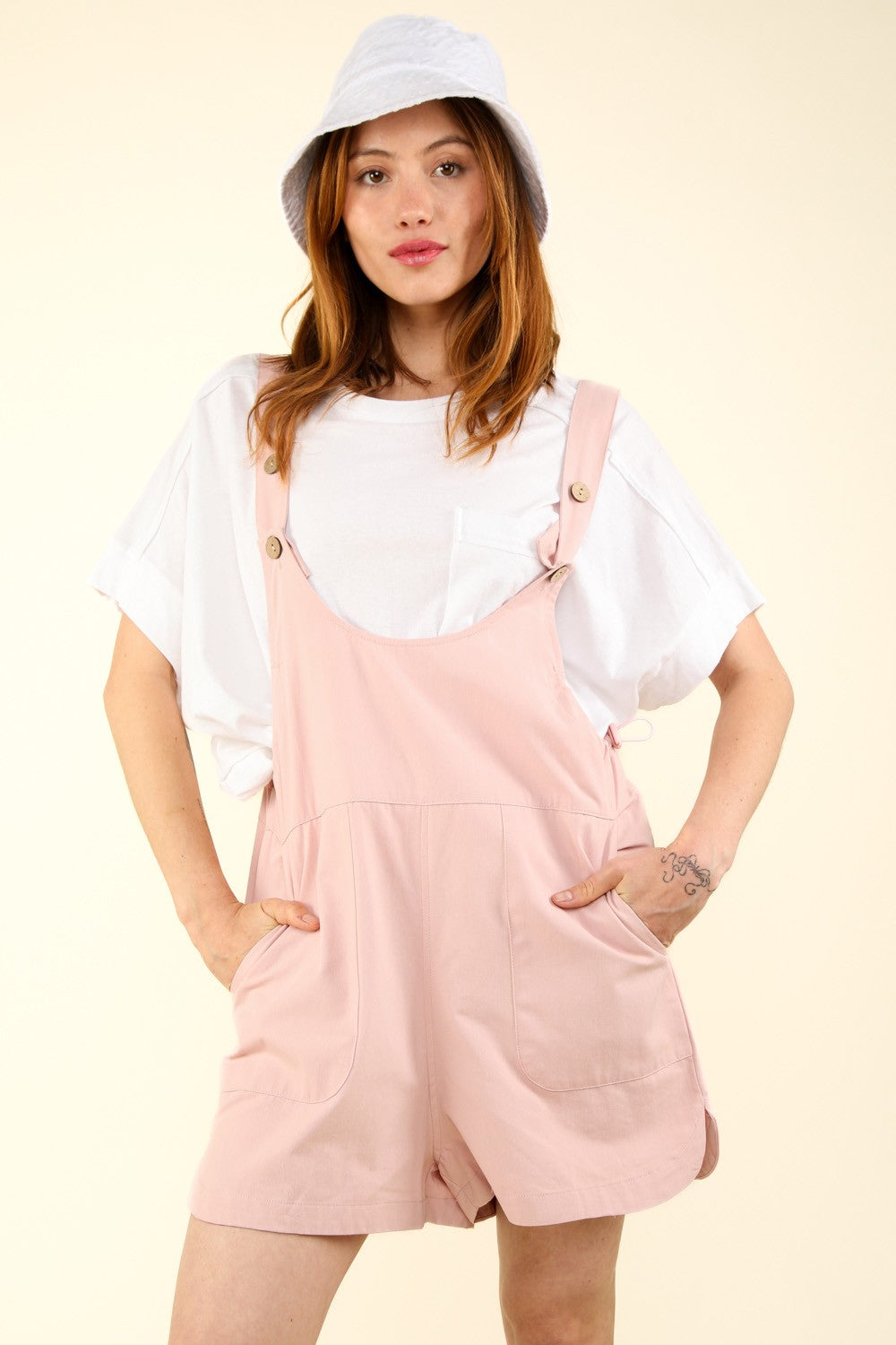 VERY J Adjustable Waist Suspender Overalls with PocketsGet ready for a casual and chic look with this sleeveless cotton romper featuring an adjustable waist and side pockets. The suspender's overall detail adds a trendy 