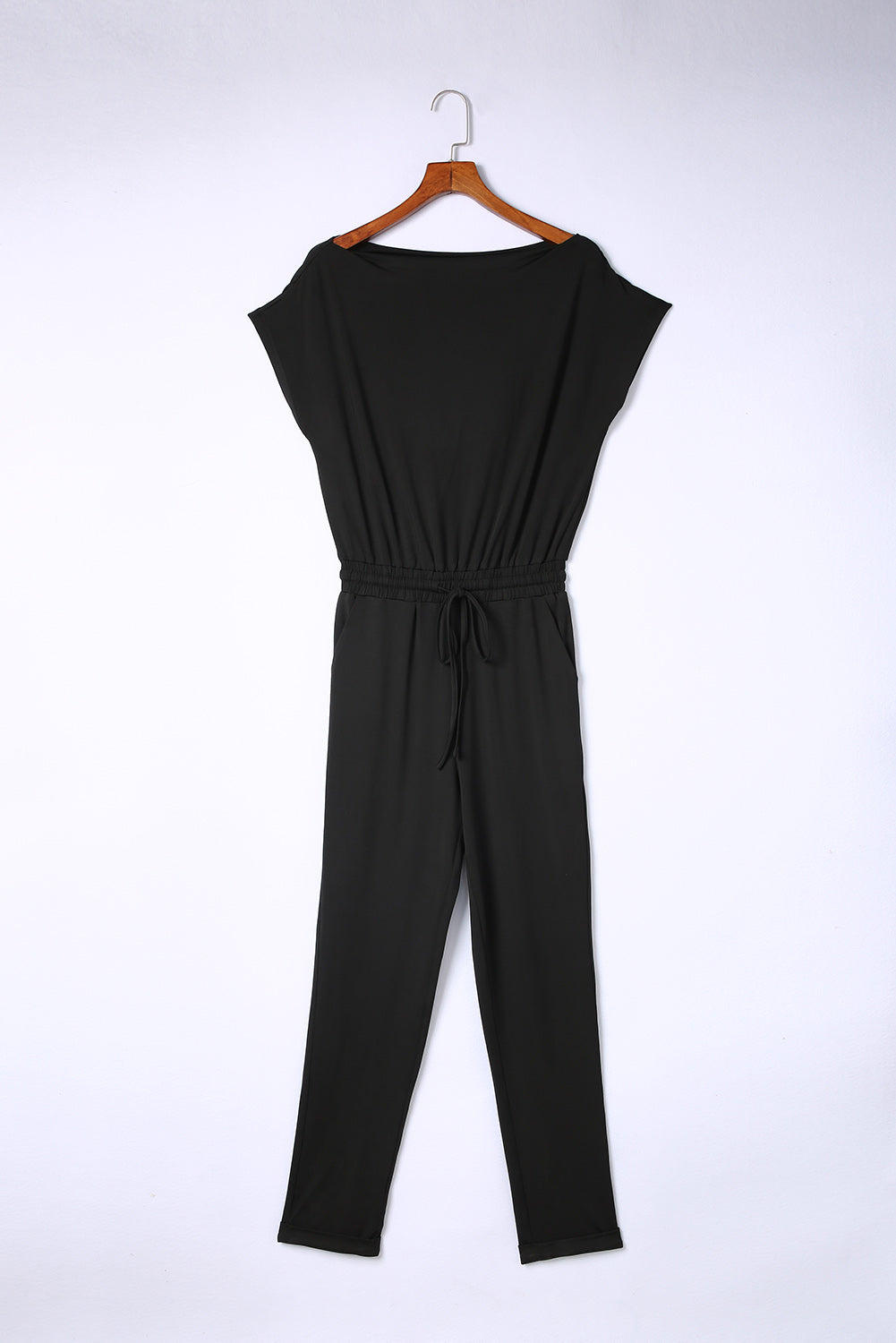 Black Tie Waist Off Shoulder Short Sleeve Tapered JumpsuitMaterial:90%Polyester+10%Elastane


	


		The short sleeves provide coverage while still allowing for ease of movement, and the tapered legs create a sleek and s