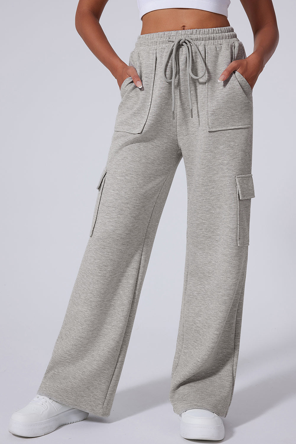 Light Grey Multi Pockets Lace Up High Waist Wide Leg Workout PantsMaterial:50%Polyester+45%Viscose+5%Elastane

• Crafted in a trendy light grey hue, these workout pants feature a lace-up design at the waist for a secure fit during