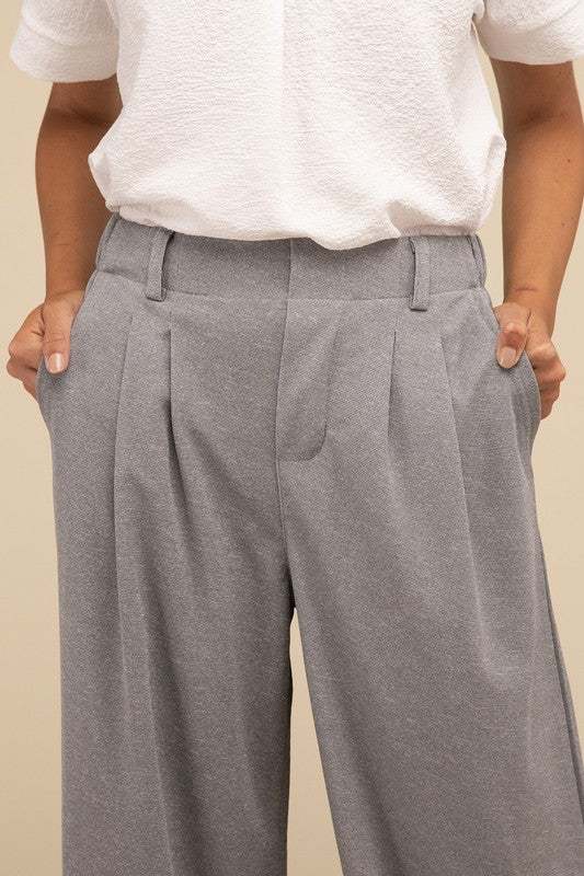 Waffle Trouser PantsElevate your everyday style with these waffle trouser pants. Crafted from textured waffle-knit fabric, they offer a perfect blend of comfort and sophistication. The 