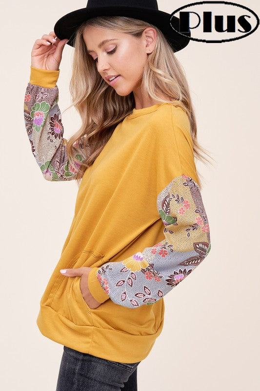 PLUS WOVEN FLORAL MIXED TOPFRENCH TERRY SOLID AND WOVEN FLORAL PRINT MIXED LONG SLEEVE SIDE POCKET RAW EDGE DETAIL PLUS TOP 
Style: Casual
Print / Pattern: SOLID AND WOVEN FLORAL 
Fit: Regular