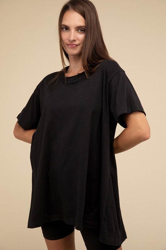 Cotton Drop Shoulder Oversized TopThe Cotton Drop Shoulder Oversized Top is a chic and comfortable addition to your wardrobe. With raw edge details adding a touch of edge, this top offers a relaxed, 