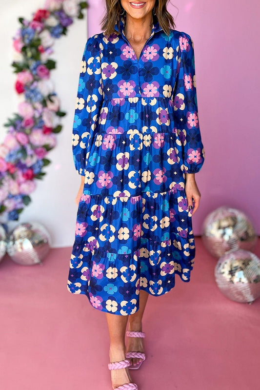 Blue Floral Peasant Sleeve Tiered Ruffle Midi DressMaterial:100%Polyester

• Embrace the charm of bohemian style with this midi dress, featuring a beautiful blue floral print that exudes effortless elegance.
• The 