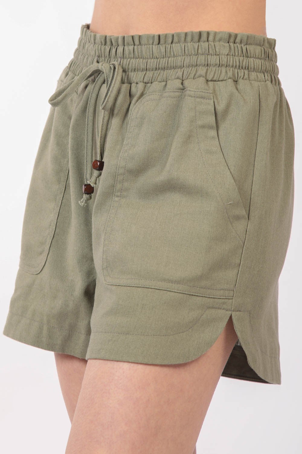 VERY J Drawstring Elastic Waist Linen ShortsStay cool and comfortable in these Elastic Waist Solid Linen Shorts featuring side pockets and a round hem for added style. These Cool Comfort Eco-Friendly Recycling