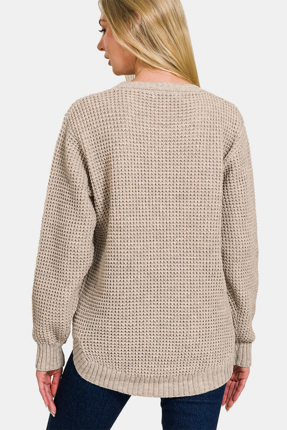 Zenana High Low Long Sleeve Waffle SweaterStay cozy and chic in this High Low Long Sleeve Waffle Sweater. With its unique waffle texture and flattering high-low hemline, this sweater is perfect for casual da