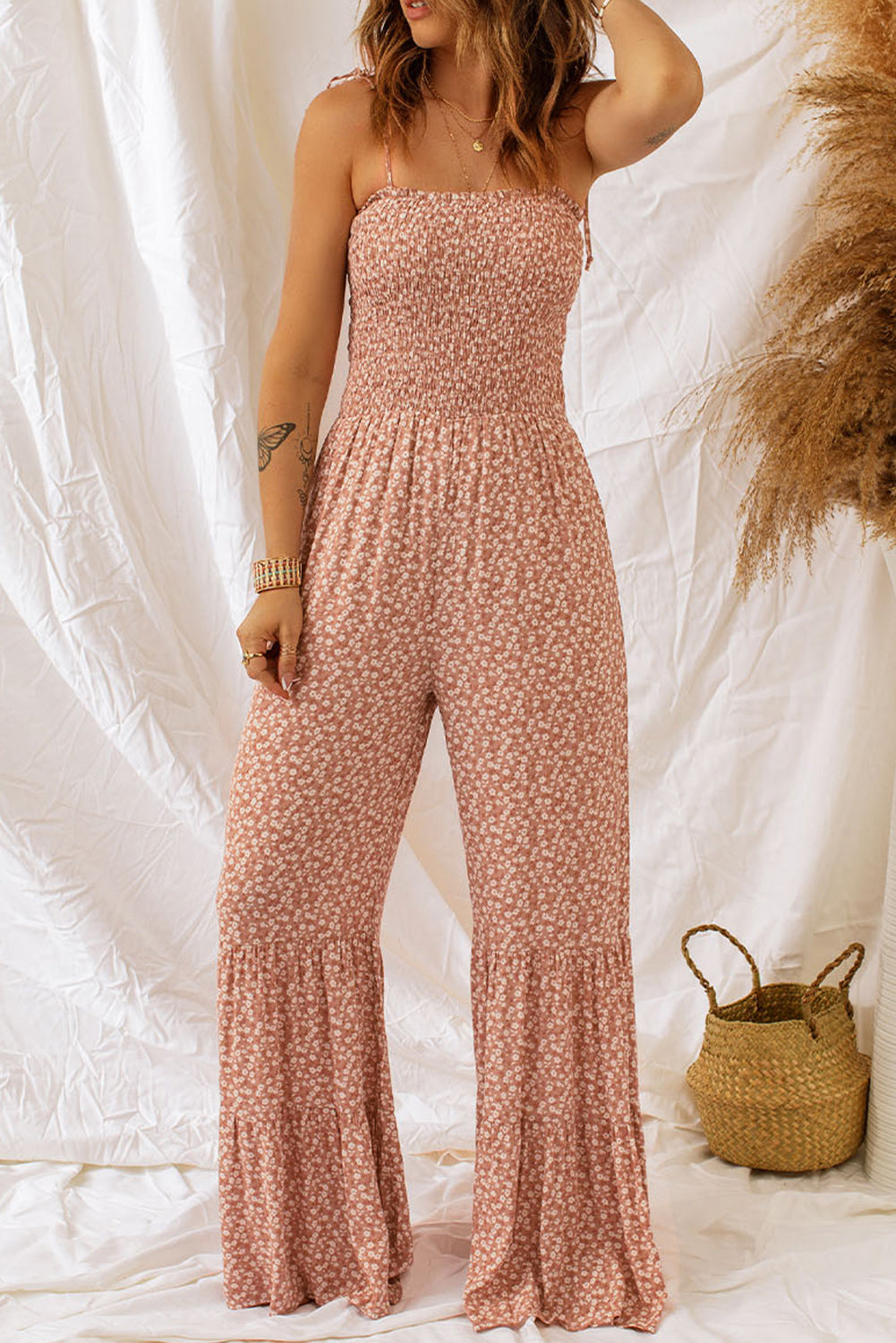 Khaki Floral Spaghetti Straps Smocked Bodice Wide Leg JumpsuitMaterial:100%Polyester



		Smoked bodice design highlights women’s
sexy body shapes.
	
	
	
		Floral jumpsuit with the wide leg is very
textured and fashiona