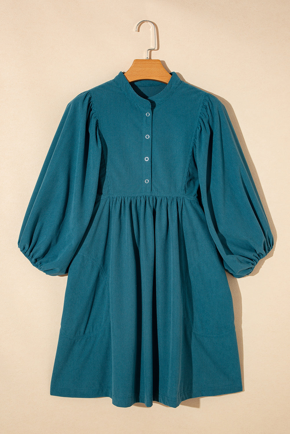 Light Blue Snap Button Empire Waist Lantern Sleeve Corduroy DressMaterial:100%Polyester

• Effortlessly chic, the mini dress exudes laid-back elegance with its soothing color and relaxed fit. 
• The soft corduroy fabric of this 