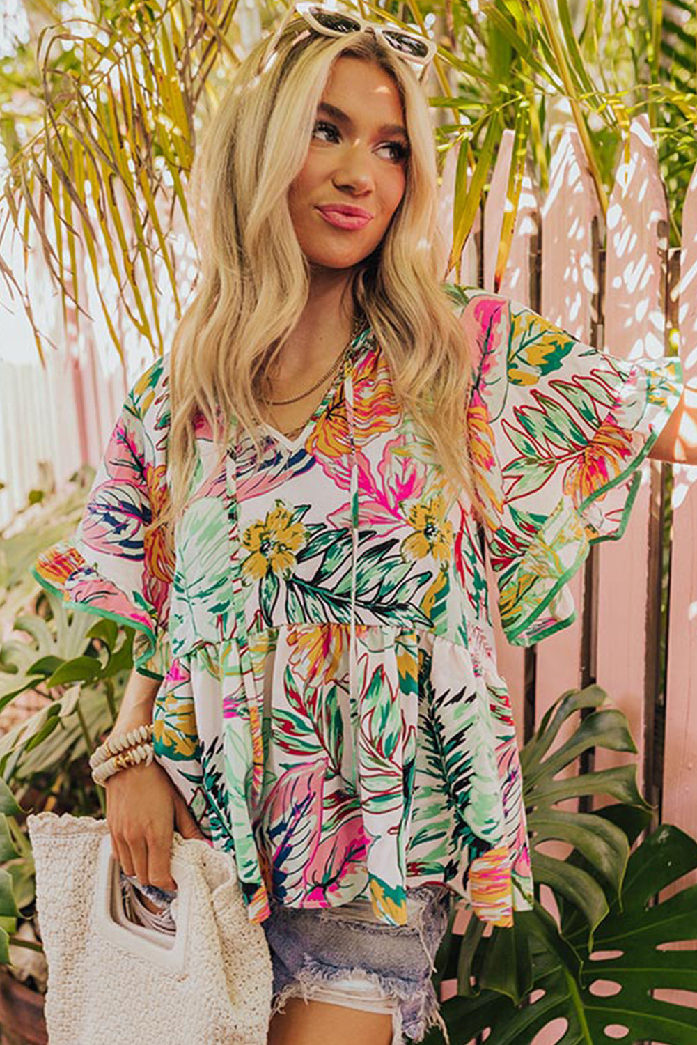 White Tropical Plant Print Tie Neck Ruffle BlouseMaterial:100%Cotton

• Embrace a touch of Boho chic with this blouse, exuding elegance and charm with its delicate floral pattern.
• Elevate your style with the gr