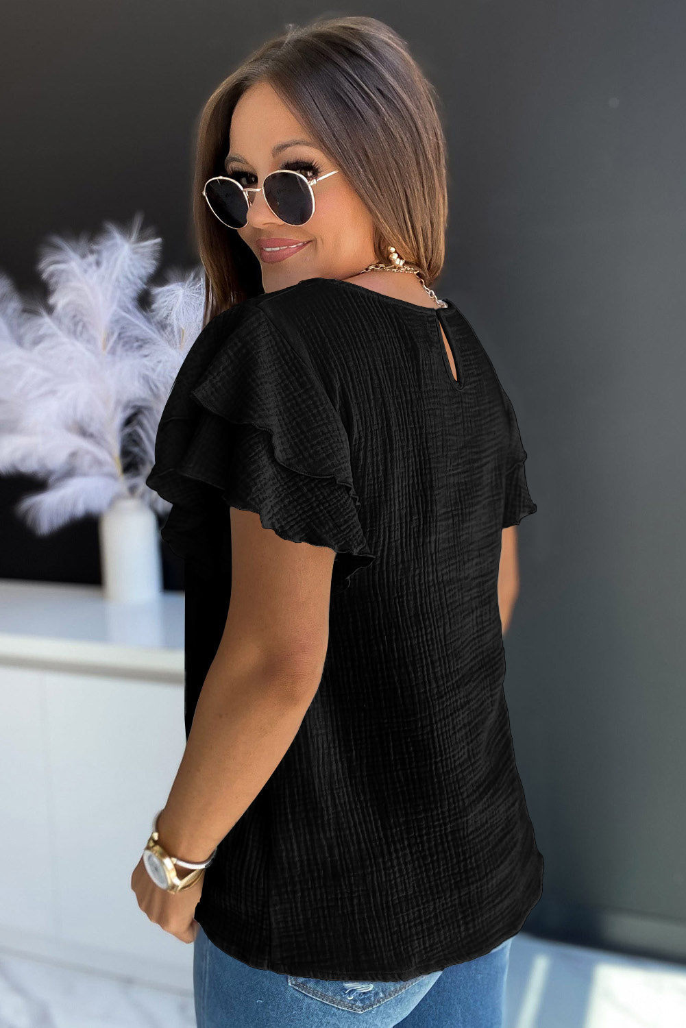 Black Textured Tiered Ruffle Casual Short Sleeve TopMaterial:100%Cotton



		•The tiered ruffle sleeves add a feminine touch to the blouse and make it stand out.
	
	
		•The blouse can be styled in many different 