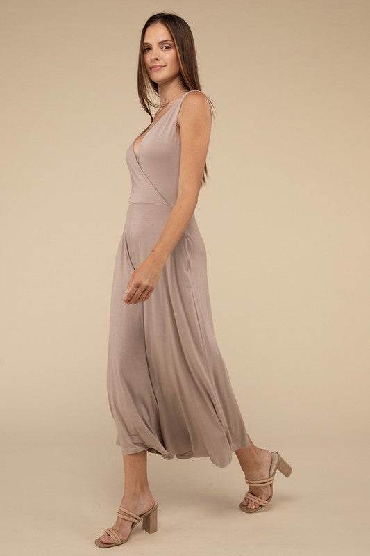 Surplice Neckline Sleeveless JumpsuitThe Surplice Neckline Sleeveless Jumpsuit exudes effortless elegance and modern sophistication. Featuring a surplice neckline, this jumpsuit offers a chic and flatte