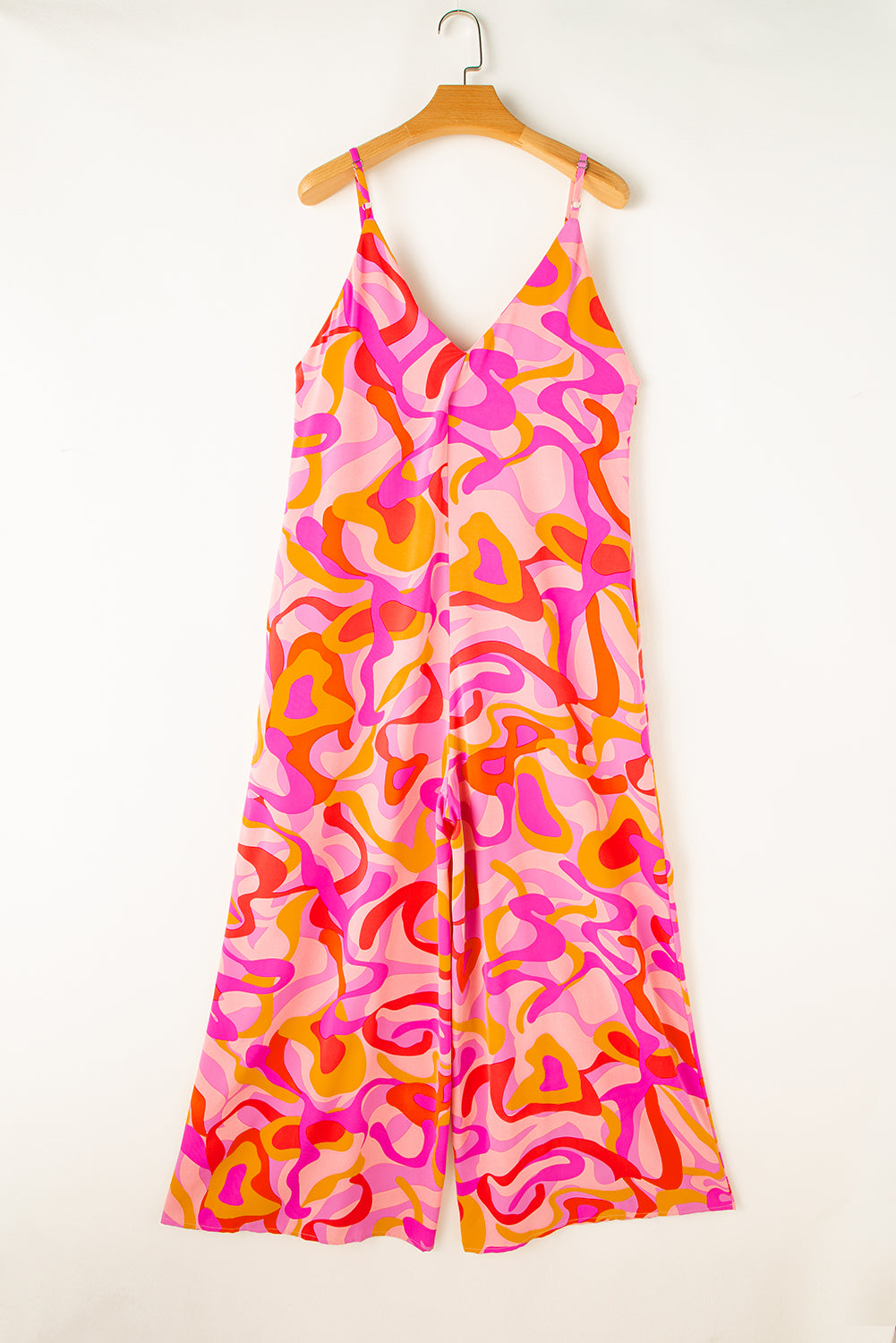 Pink Abstract Print V Neck Slouchy Wide Leg JumpsuitMaterial:100%Polyester

• Embrace a bohemian vibe with this jumpsuit, featuring a unique abstract pattern that adds a touch of artistic flair to your outfit.
• Sta