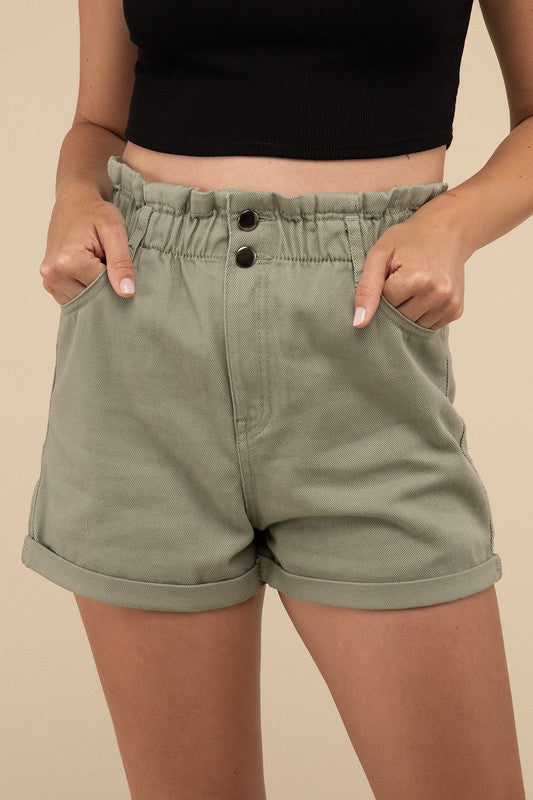 Double Buttoned Waistband Denim ShortsThe Double Buttoned Waistband Denim Shorts are a stylish and comfortable addition to your wardrobe. Featuring a unique double-button closure and a charming ruffled w