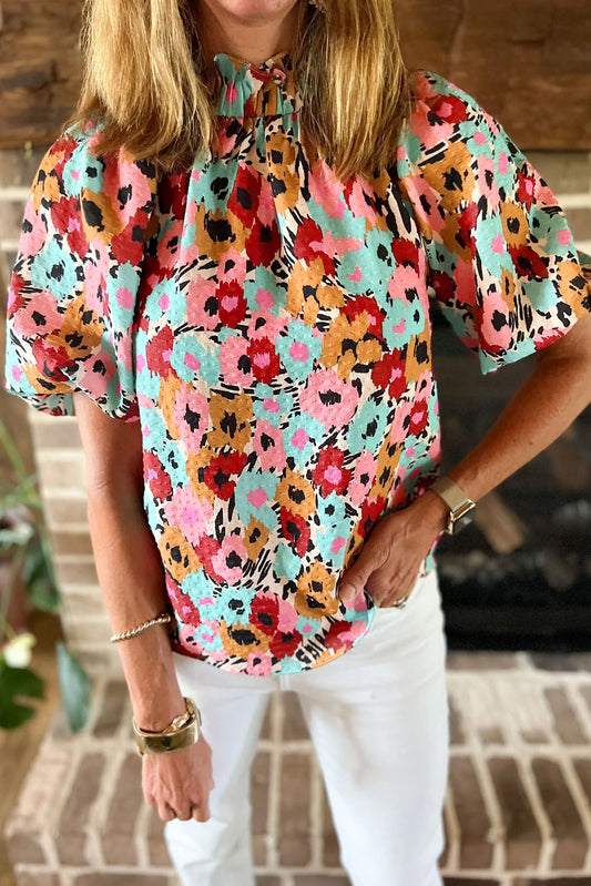 White Frilled Floral Print Puff Sleeve Mock Neck BlouseMaterial:100%Polyester



		The blouse features a frilled hem, adding a feminine and playful touch to the overall silhouette. 
	
	
		Pair it with jeans and flat