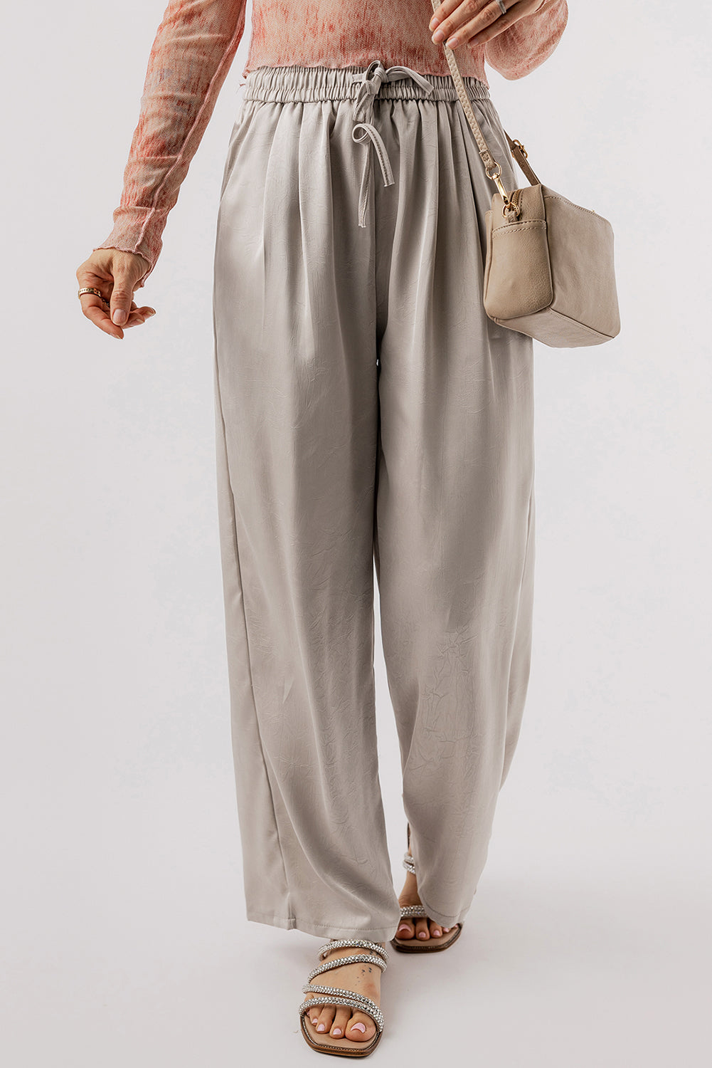 Jet Stream Solid Pleated Drawstring High Waist Wide Leg PantsMaterial:100%Polyester

• Elevate your wardrobe with the pants, designed for all-day comfort and style.
• The pleated detailing adds a touch of sophistication, whi