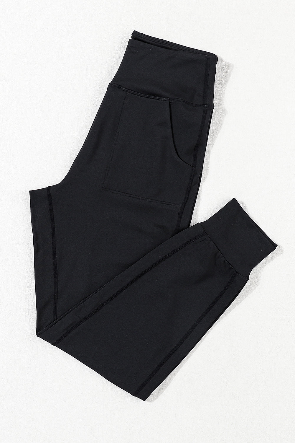 Black Exposed Seam High Waist Pocketed JoggersMaterial:100%Polyester



		These solid joggers are a versatile addition to your wardrobe, suitable for individuals of all body types.

	
		The exposed seam desi