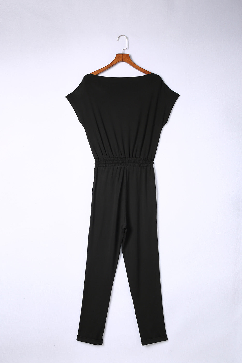 Black Tie Waist Off Shoulder Short Sleeve Tapered JumpsuitMaterial:90%Polyester+10%Elastane


	


		The short sleeves provide coverage while still allowing for ease of movement, and the tapered legs create a sleek and s