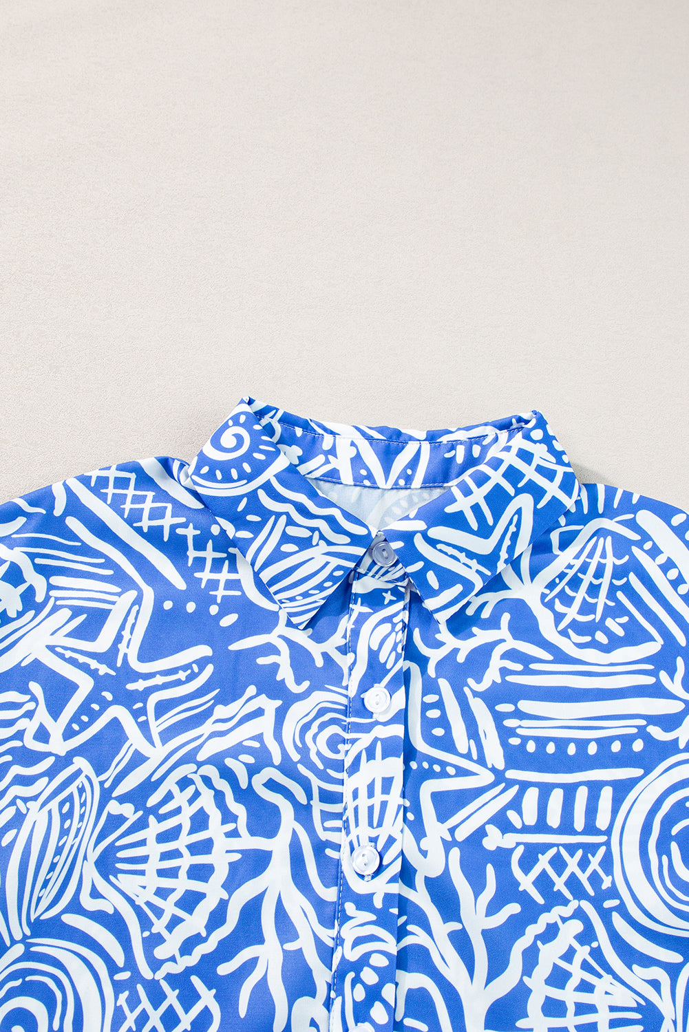 Blue Abstract Print Cuffed Sleeve Button Up BlouseMaterial:100%Polyester

• Stand out in style with our shirt, featuring a vibrant boho abstract design that exudes artistic flair.
• Embrace versatility with this s