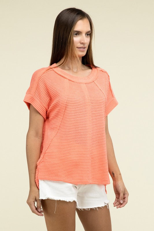 Brushed Waffle Exposed-Seam Short Sleeve TopElevate your casual wardrobe with this Brushed Waffle Top, featuring side slits, exposed seam details, and a stylish hi-low hem. Perfect for a relaxed yet trendy loo