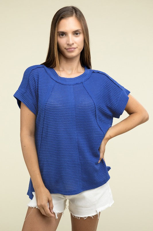 Brushed Waffle Exposed-Seam Short Sleeve TopElevate your casual wardrobe with this Brushed Waffle Top, featuring side slits, exposed seam details, and a stylish hi-low hem. Perfect for a relaxed yet trendy loo