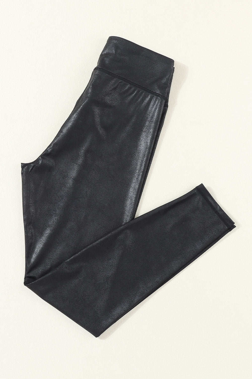 Black Crossed Dip Waist Sleek Leather LeggingsMaterial:92%Polyester+8%Elastane



		Get ready to conquer the fashion world in these sassy leather leggings. 
	
	
		They feature a cross-front waistband with s