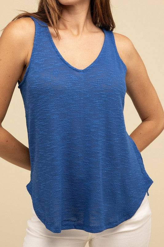 V Neck Sleeveless Cami TopThe V Neck Sleeveless Cami Top is a chic and versatile addition to any wardrobe. Featuring a flattering V neckline and a sleeveless design, this cami top is perfect 