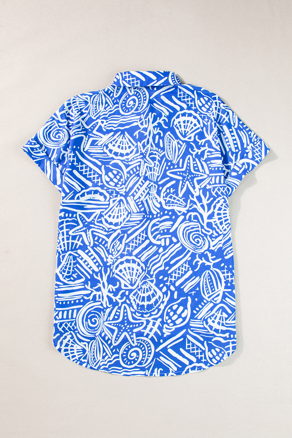 Blue Abstract Print Cuffed Sleeve Button Up BlouseMaterial:100%Polyester

• Stand out in style with our shirt, featuring a vibrant boho abstract design that exudes artistic flair.
• Embrace versatility with this s