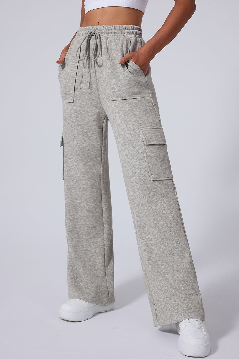 Light Grey Multi Pockets Lace Up High Waist Wide Leg Workout PantsMaterial:50%Polyester+45%Viscose+5%Elastane

• Crafted in a trendy light grey hue, these workout pants feature a lace-up design at the waist for a secure fit during