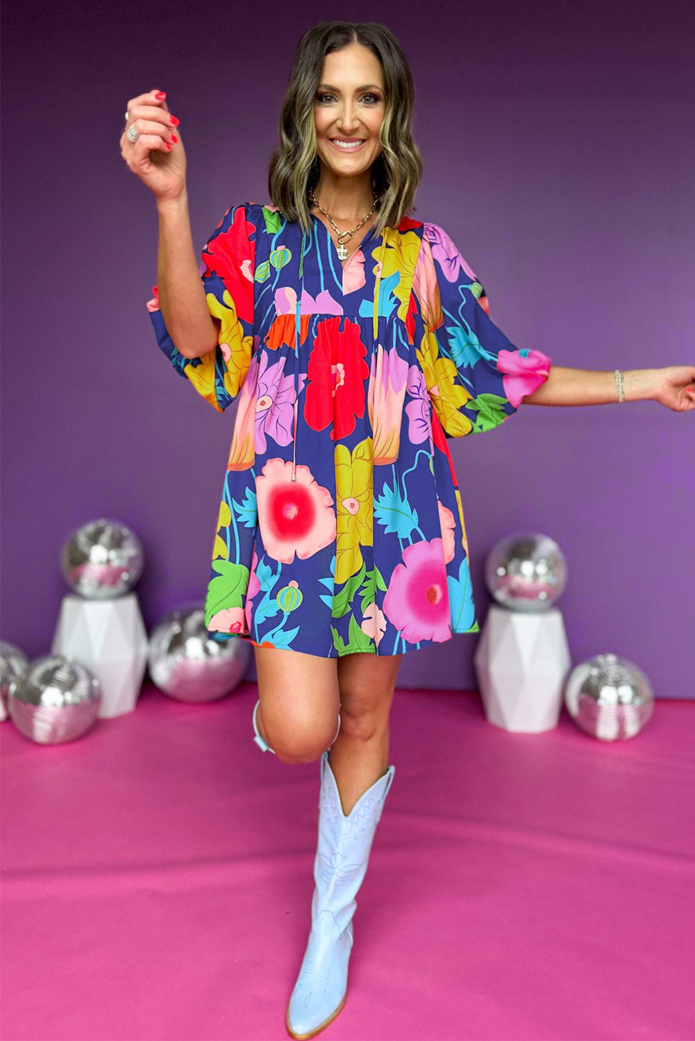 White Puff Sleeve Tied Split Neck Colorful Floral Flowy DressMaterial:100%Cotton


	


		Step into elegance with our mini dress, a vibrant and feminine piece designed to make a statement.
	
	
		This dress features charm