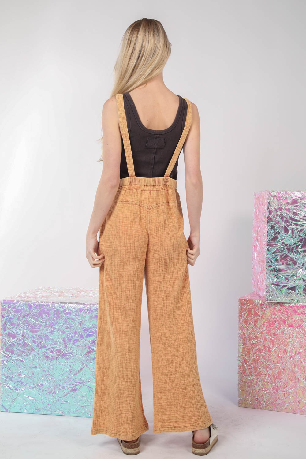 VERY J Texture Washed Wide Leg OverallsThe texture washed wide leg overalls offer a stylish and relaxed look with a touch of vintage charm. Made from textured fabric, these overalls have a unique appearan