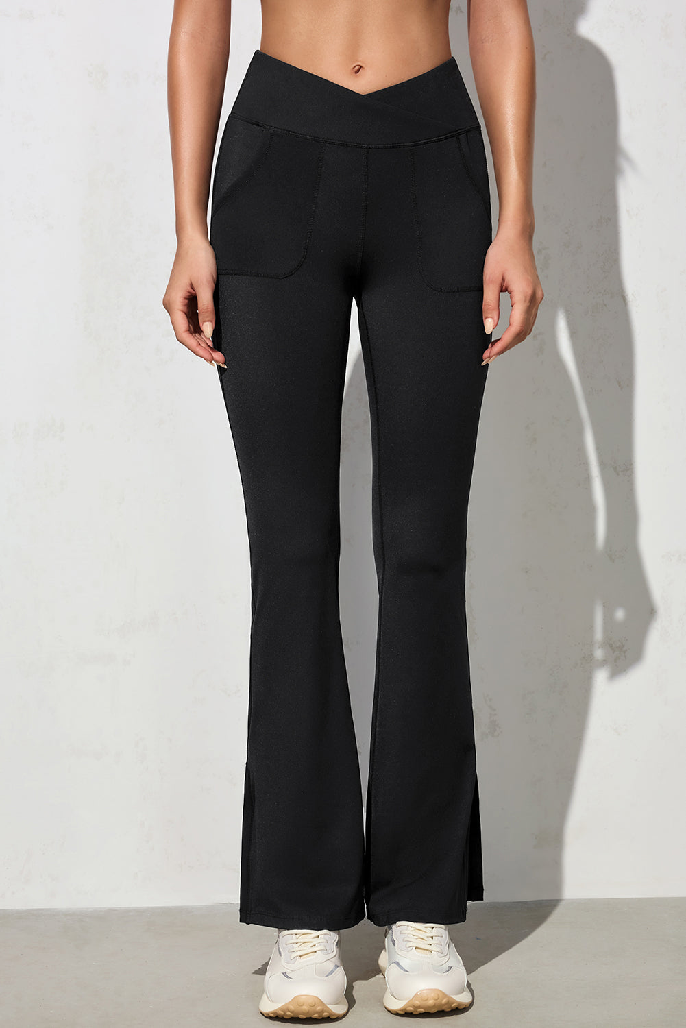 Black Cross Waist Pocketed Split Hem Flared LeggingsMaterial:75%Polyamide+25%Elastane



		Elevate your everyday look with these stylish pants made from soft, high-quality material that offers a comfortable stretch 