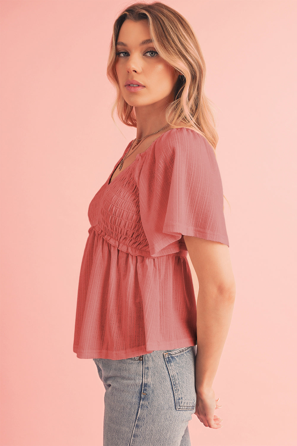 Tomato Red Shirred V Neck Short Flutter Sleeve Textured BlouseMaterial:95%POLYESTER+5%ELASTANE



		The blouse is a charming and feminine top featuring a shirred V-neckline and delicate flutter sleeves, adding a touch of eleg