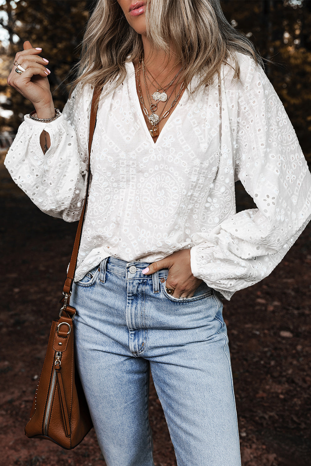 White Eyelet Embroidered V Neck Puff Sleeve BlouseMaterial:100%Cotton

• Delicate white eyelet embroidery adorns this charming blouse, adding a touch of elegance to your outfit. 
• The V-neck design creates a flat