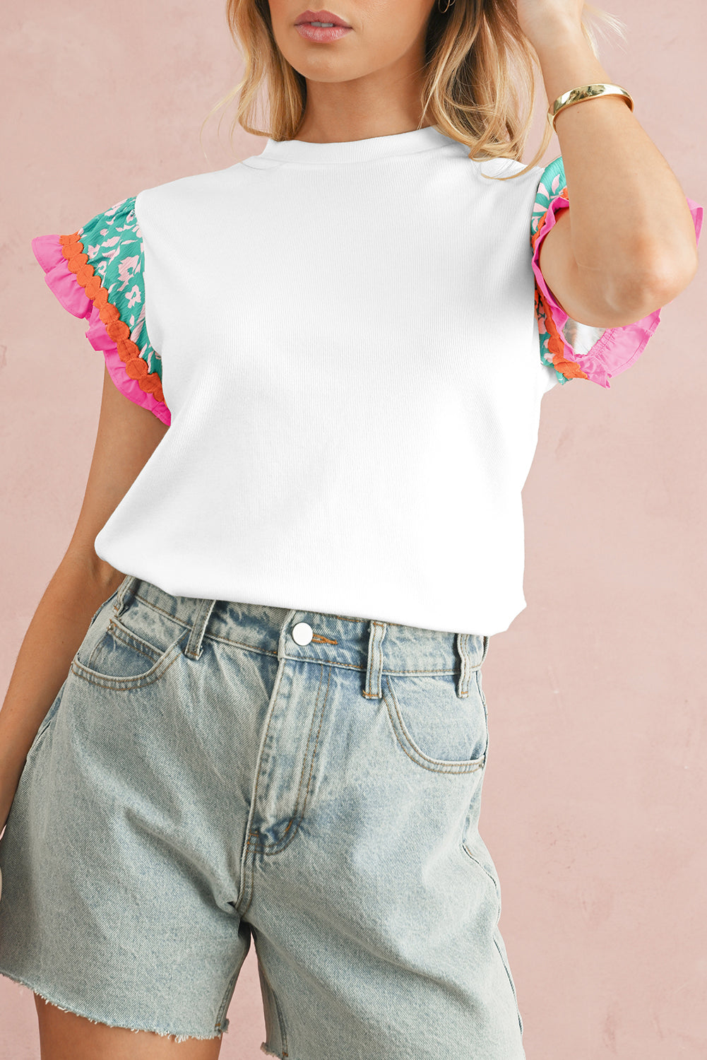 White Color Block Floral Print Ruffle Sleeve BlouseMaterial:70%Polyester+25%Cotton+5%Elastane

• Stand out in style with this blouse, featuring delicate floral appliques and charming ruffle details.
• Embrace a cas