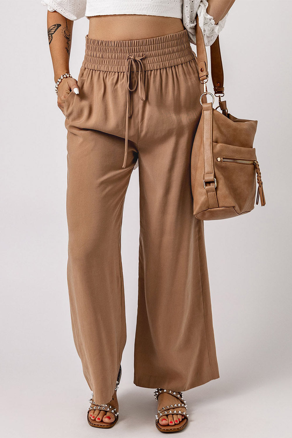 Blue Casual Drawstring Shirred Elastic Waist Wide Leg PantsMaterial:65%Viscose+35%Polyester



		These wide leg pants
are casual and comfy with a loose fit style
	
	
		The smocked waist
design is fashionable and very 