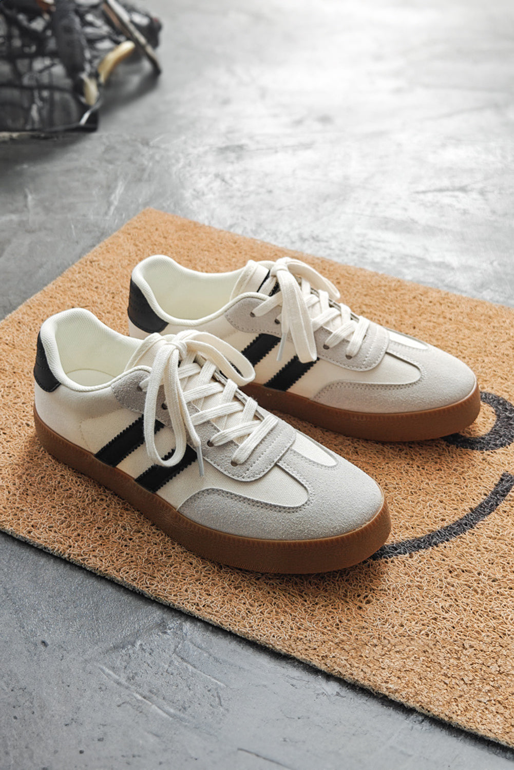 White Striped Lace Up Flat Sneakers• Stylish and versatile, these lace-up sneakers feature a chic white color with subtle stripes.
• Crafted with comfort in mind, the flat sole provides all-day suppo