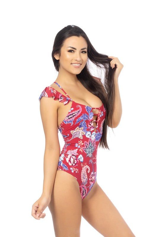 RED PAISLEY ONE PIECE SWIMSUITRed paisley printed deep scoop one piece featuring ladder front detail, ruffled sleeves, and adjustable crisscross back. Moderate to full coverage bottom, removable 