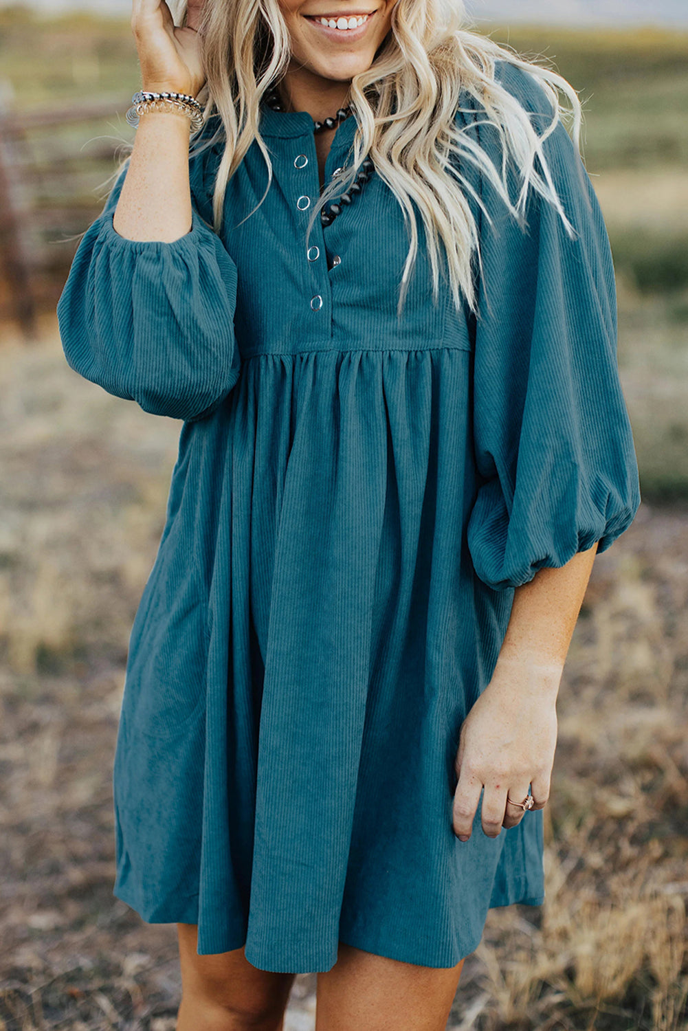 Light Blue Snap Button Empire Waist Lantern Sleeve Corduroy DressMaterial:100%Polyester

• Effortlessly chic, the mini dress exudes laid-back elegance with its soothing color and relaxed fit. 
• The soft corduroy fabric of this 