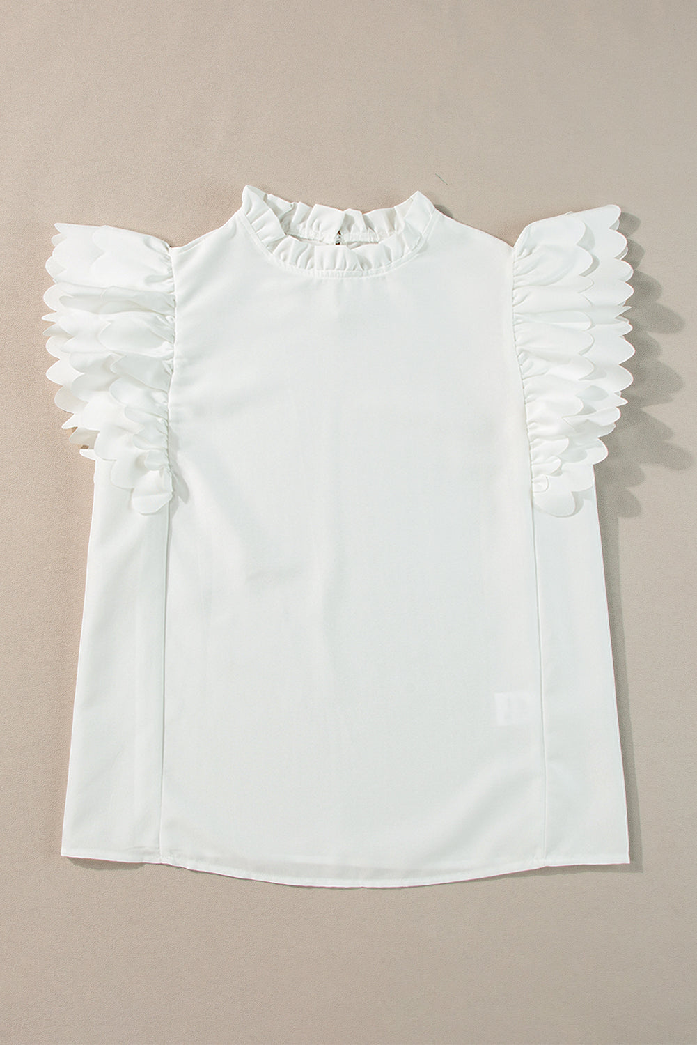 White Solid Color Scalloped Ruffle Sleeve BlouseMaterial:100%Polyester



		The blouse is a chic and feminine top featuring delicate scalloped edges and ruffle sleeves, adding a touch of elegance to your outfit.