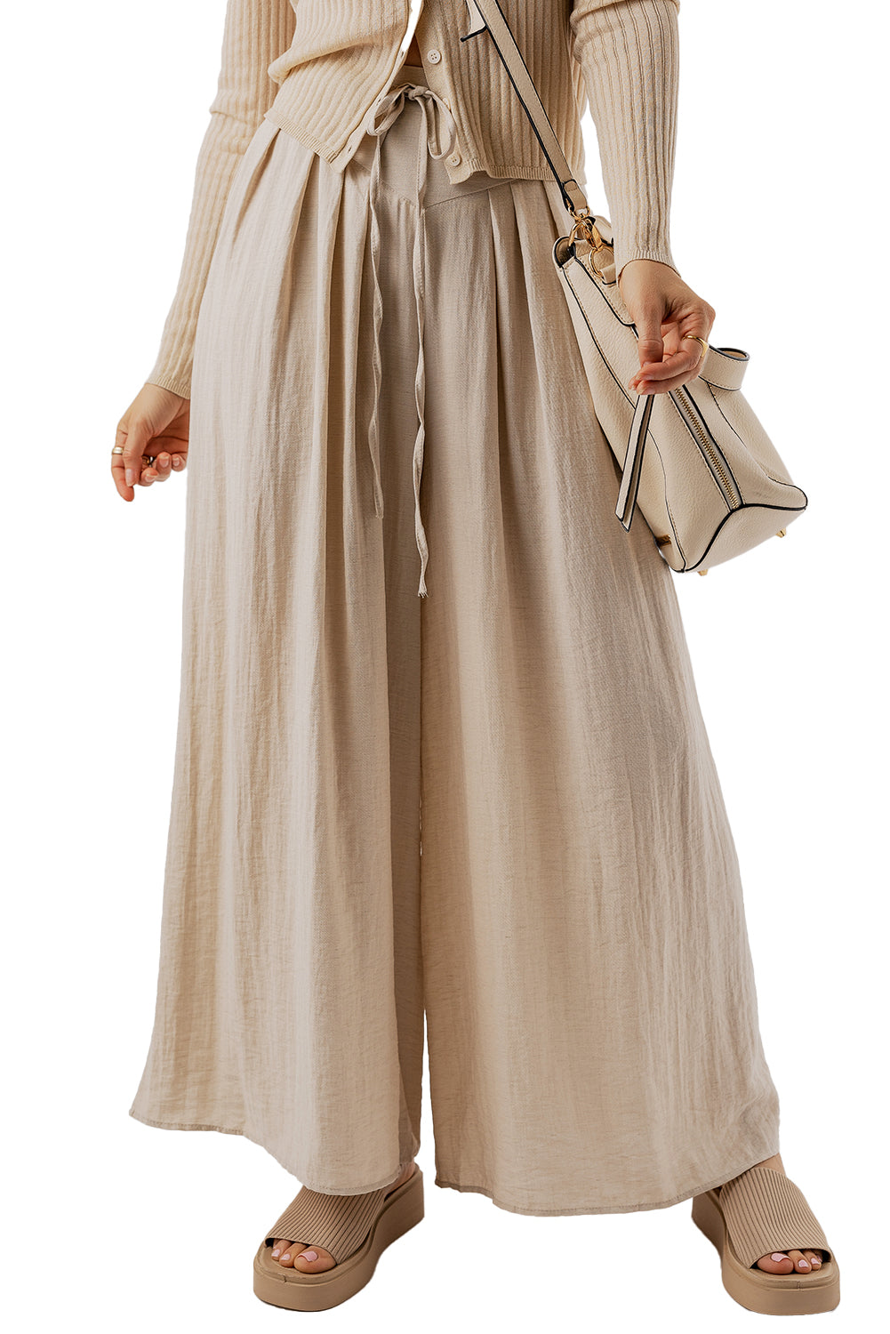 Beige Casual Lace-up Waist Pleated Wide Leg PantsMaterial:67%Viscose+21%Polyamide+12%Linen

• Effortlessly chic, the pants feature a tie waist for a customizable fit and pleated details for a touch of sophisticati